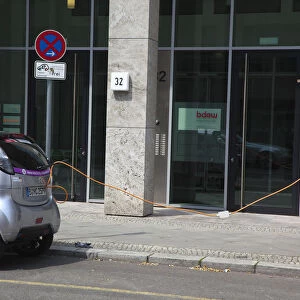Germany, Berlin, Mitte, Citroen electric car being charged at roadside point