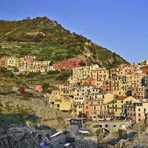 Italy, Liguria, Cinque Terre, Manarola, General vista of the town bathed in evening