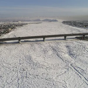 An aerial view shows a bridge across the Yenisei River in Kyzyl