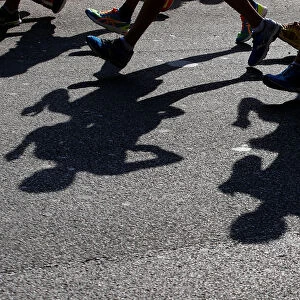 Athletes cast their shadows during the mens 20 kilometres race walk at the World