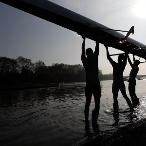 The Cambridge University rowing crew prepare for a training session on the River Thames