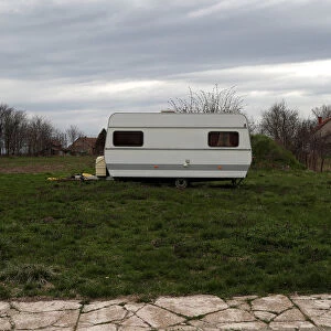 A caravan is seen on an empty lot in the village of Bacsszentgyorgy