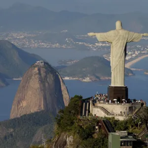 The Christ the Redeemer statue is pictured with the Sugar Loaf mountain in the background