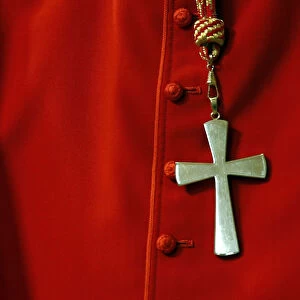 A cross is seen on a Cardinal cassock during a mass in St