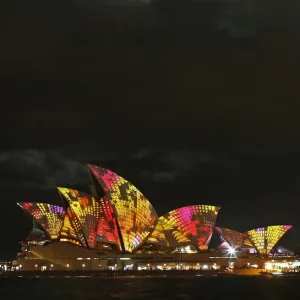 A cruise ship navigates past the Sydney Opera House as Play by The Spinifex Group