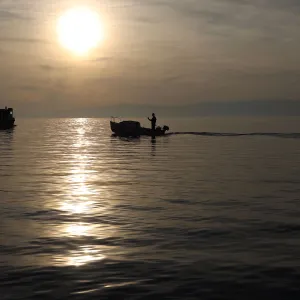 Fishermens boats are seen during a sunset in Kraljevica