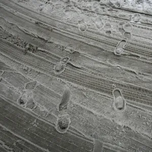 Footprints are left in the slush on a street during a snow storm in downtown New York