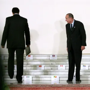 Frances President Chirac waits for fellow leaders to take their places at the Francophone