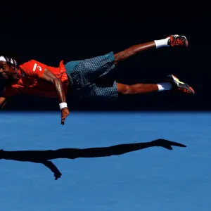 Gael Monfils dives for a shot