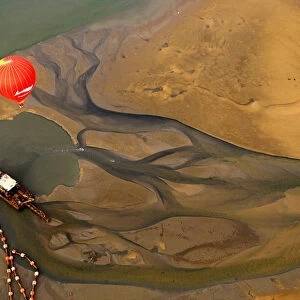 A hot air balloon flies across the Qiongzhou strait during the first Haikou Fire Balloon