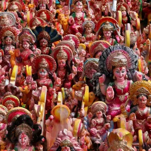 Idols of Hindu Goddess Dashama, left by devotees, are pictured on the banks of river