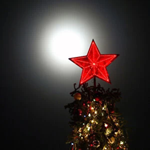 Illuminated red star sits atop Christmas tree in southern Russian city of Stavropol