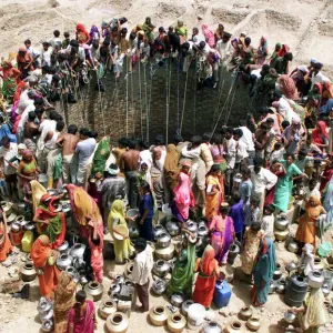 Print of People Gathered Around a Village Well