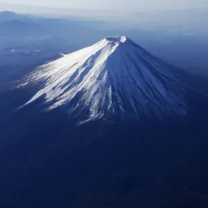 Japans Mount Fuji is seen covered with snow from an airplane