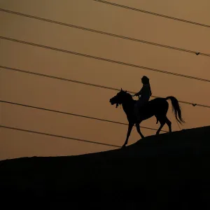 A man rides a horse in the holy Shi ite city of Najaf