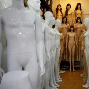 Mannequins are displayed for sale at a shop in Hanoi, Vietnam