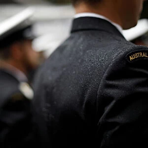 A military serviceman marches in the rain during an Anzac Day parade in Sydney
