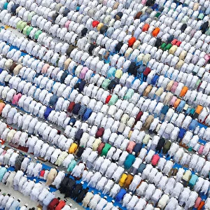 Muslims offer Eid al-Fitr prayers marking the end of the holy fasting month Ramadan
