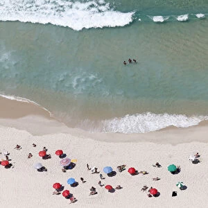 People enjoy the Barra da Tijuca beach in Rio de Janeiro