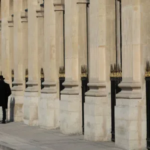 People walk on a warm spring morning in the Jardin du Palais Royal