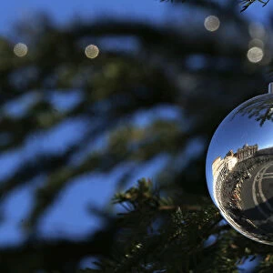 Saint Peters Square is reflected on an ornament as Pope Francis leads the Angelus