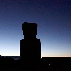 The silhouette of the Ponce Monolith is seen at the Tiahuanaco ruins the day that marks