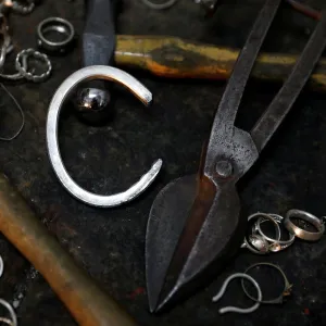 Silver jewellery parts and work tools are seen in the workshop of goldsmith Gavriel