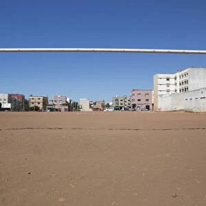 A soccer goalpost stands in a field in Rabat