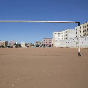 A soccer goalpost stands in a field in Rabat