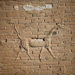 A view of a dragon on the wall of the ancient city of Babylon near Hilla