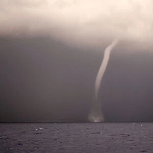 A waterspout is seen from the German NGO Sea-Eye migrant rescue ship Alan Kurdi as it