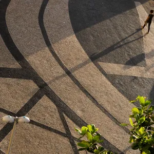 A woman walks in a sidewalk in Copacabana in Rio de Janeiro