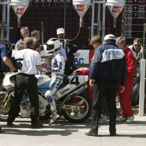 Pit stop action for Robert Dunlop (Oxford Ducati) 1993 Formula One TT