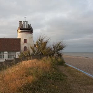 Tower mill converted to residential accommodation beside shingle beach, Fort Green Mill, Aldeburgh, Suffolk, England