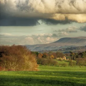 View across farmland towards distant fells, looking towards Pendle Hill, Clitheroe, Forest of Bowland, Lancashire