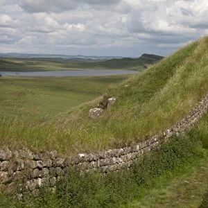 View of moorland and lake with remains of Roman fortifications, Hadrians Wall