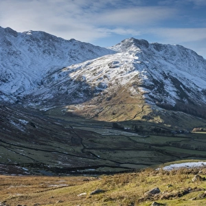View across valley towards snow covered fell, Langdale Fell, Great Langdale, Lake District N. P