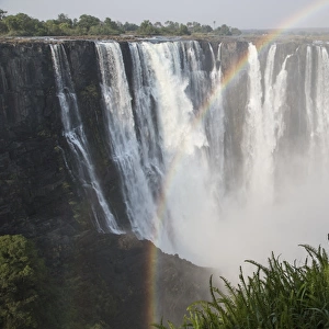 Africa, Zimbabwe, Victoria Falls. Landscape of waterfall and rainbow
