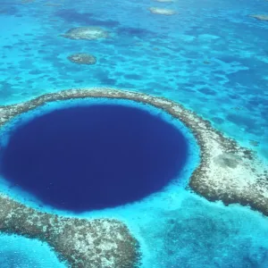 CA, Belize. Aerial view of Blue Hole (diameter 1000 ft.) at Lighthouse reef