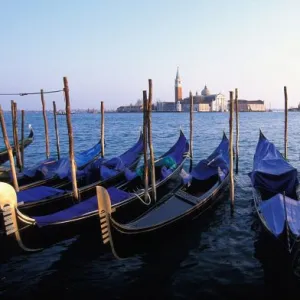 Italy, Veneto, Venice, Row of Gondolas and San Giorgio Maggiore