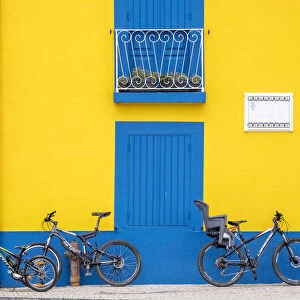 Portugal, Aveiro. Yellow house with blue shutters, windows and doors in the city of Aveiro