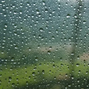 Rain drops on a cable car going up the mountains in the Bavarian Alps