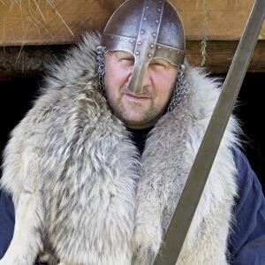 Reenactor as sword-wielding Viking Erik the Red, the father of Leif Eriksson