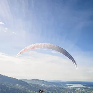 United States, Washington, Issaquah. Paragliders launch from Tiger Mountain and soar