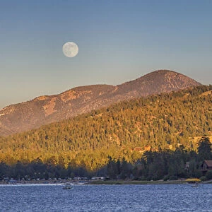 USA, California, Big Bear. Moonrise and sunset over Big Bear Lake in Southern California
