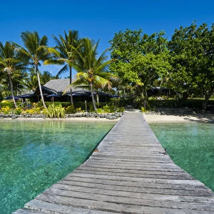 Wooden pier leadin to a resort on Aore islet before the Island of Espiritu Santo