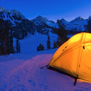Yellow dome tent in winter, John Muir Wilderness, Sierra Nevada Mountains, California USA