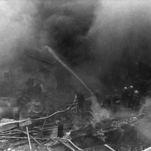 Firefighters in action after air raid, WW2