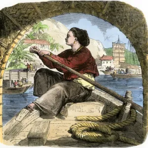 Young woman in Canton rowing a sampan