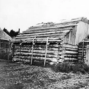 ALASKA: LOG CABIN, c1899. Log cabins in Kodiak, Alaska. Photograph by Edward Curtis
